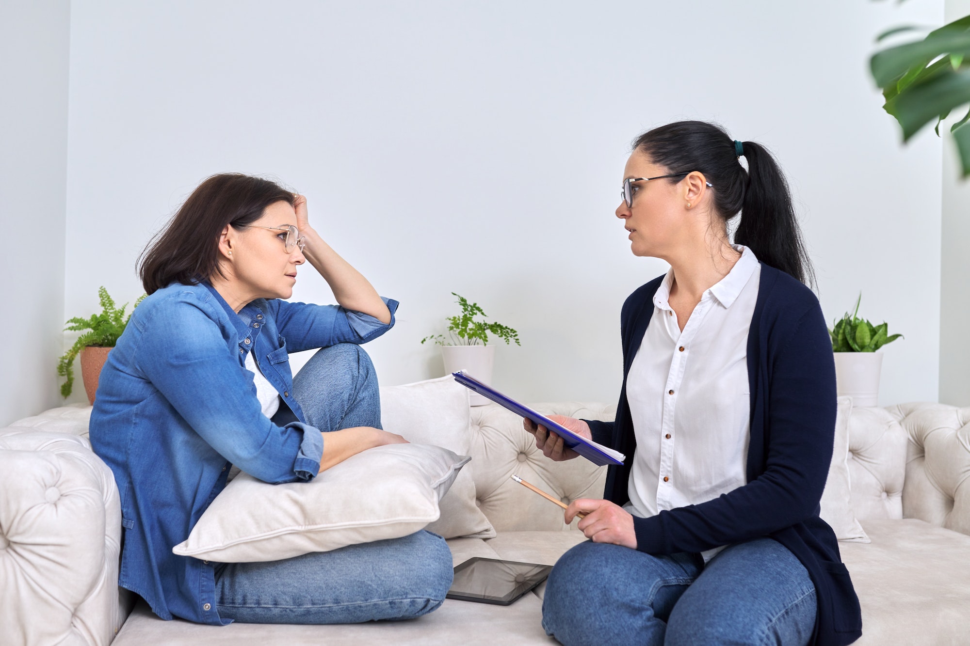Mature woman at meeting with psychologist, therapist, counselor
